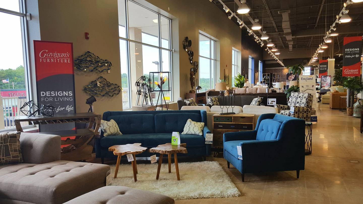 Design associate helping customers plan a room at Gavigan's furniture showroom in Maryland